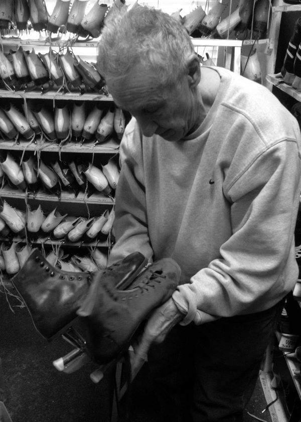 Man holding skates